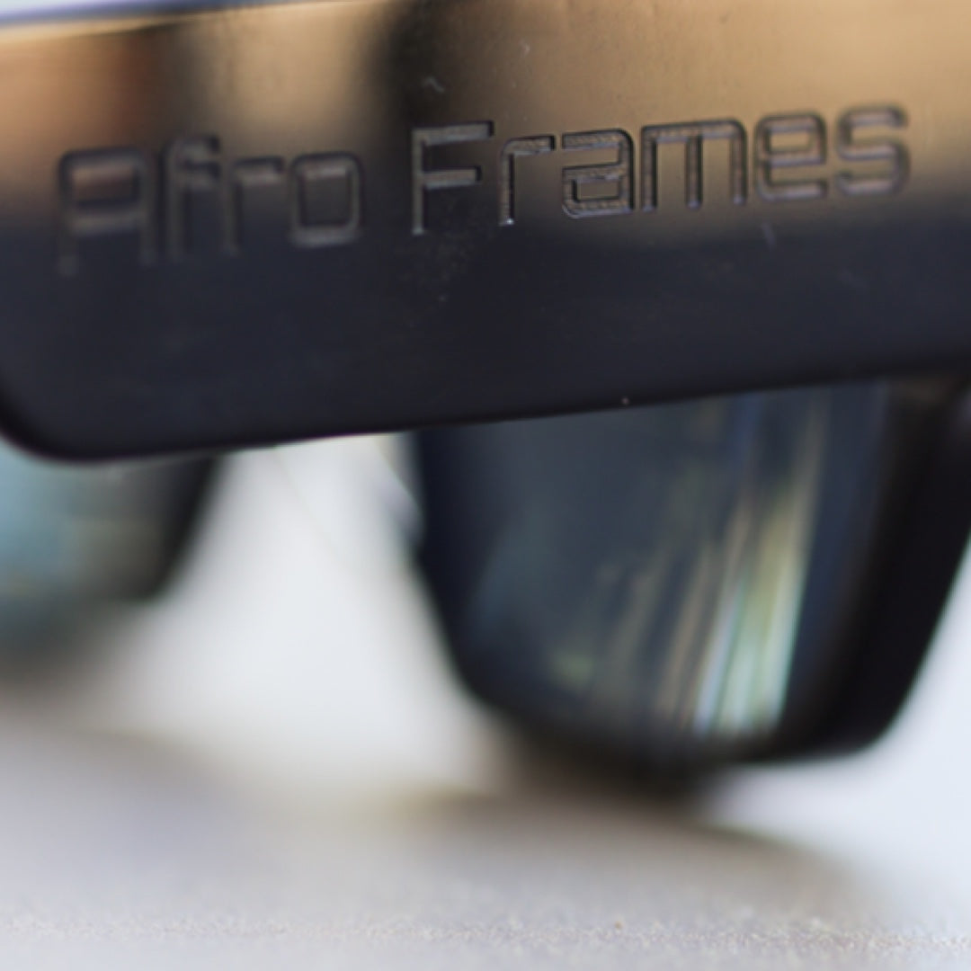 The Blacked Edition — tonal laser-engraved Afro Frames temple detail